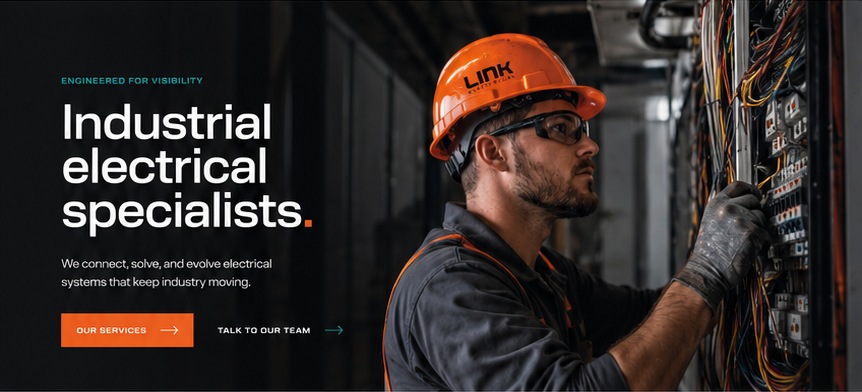 Link Electrical technician inspecting a switchboard on site